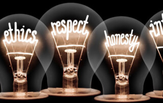 Image of four light bulbs that say ethics respect honesty and integrity