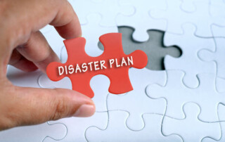 Image of a puzzle with a piece that says 'disaster plan'