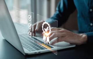 Image of a person using a laptop with check icons